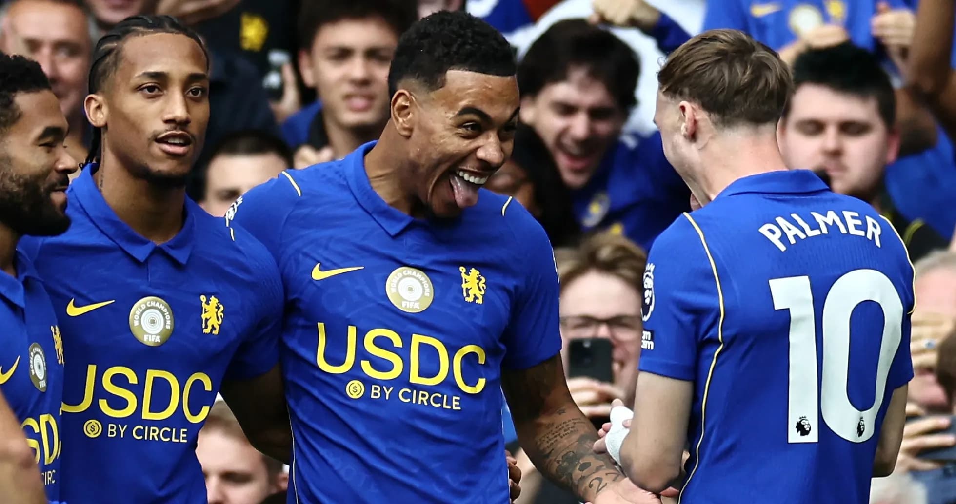 Chelsea players celebrating a goal during a match Chelsea players celebrating a goal during a match