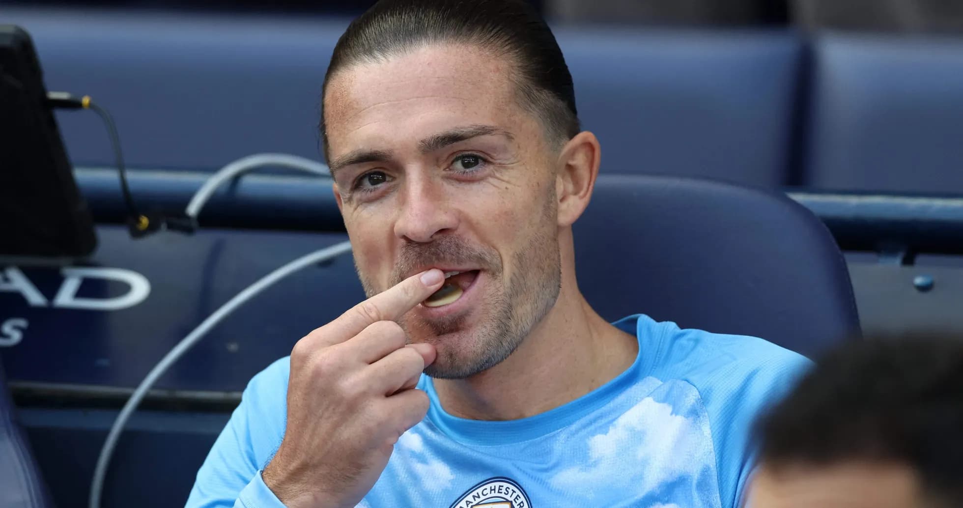 Player sitting on bench eating during match Player sitting on bench eating during match