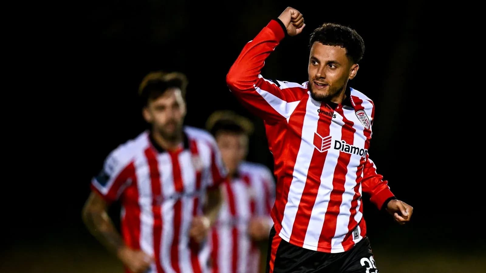 Player celebrating after scoring a goal Player celebrating after scoring a goal