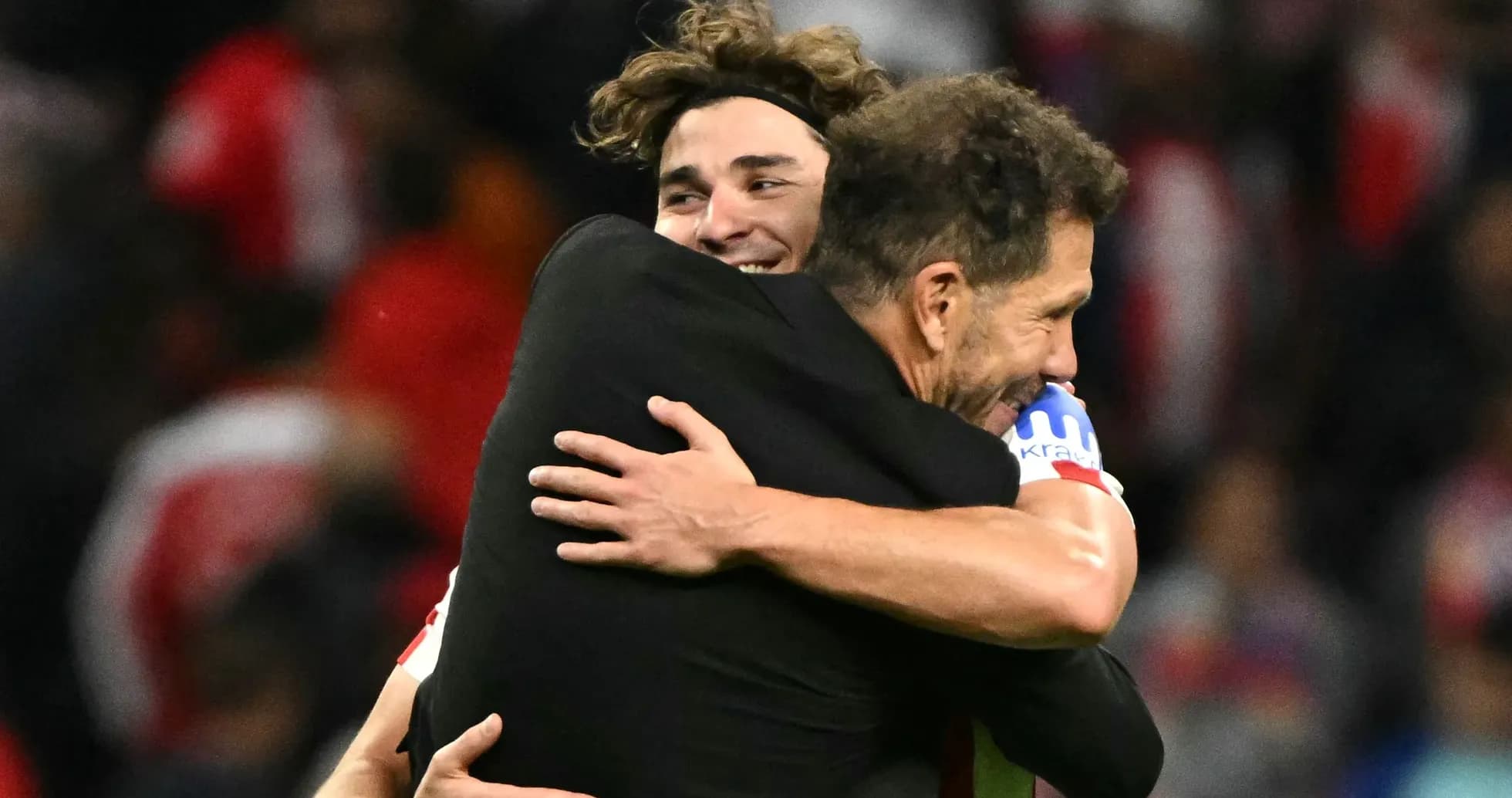 Players embracing after a match celebration Players embracing after a match celebration
