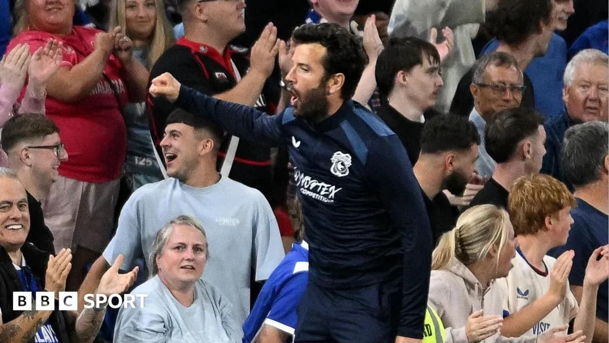 Player celebrating with fans in the stands Player celebrating with fans in the stands