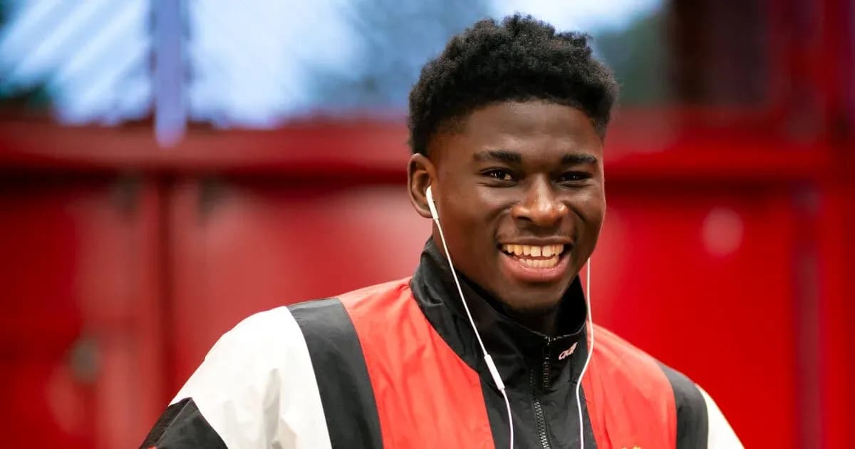 Smiling player wearing headphones in training facility Smiling player wearing headphones in training facility