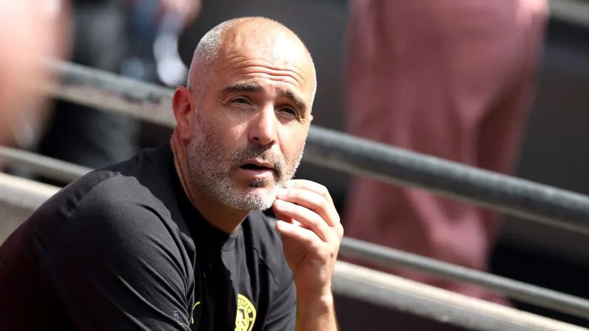 Coach sitting on the bench during a match Coach sitting on the bench during a match