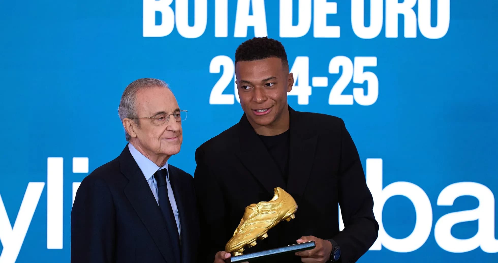 Player receiving Golden Boot award from official Player receiving Golden Boot award from official