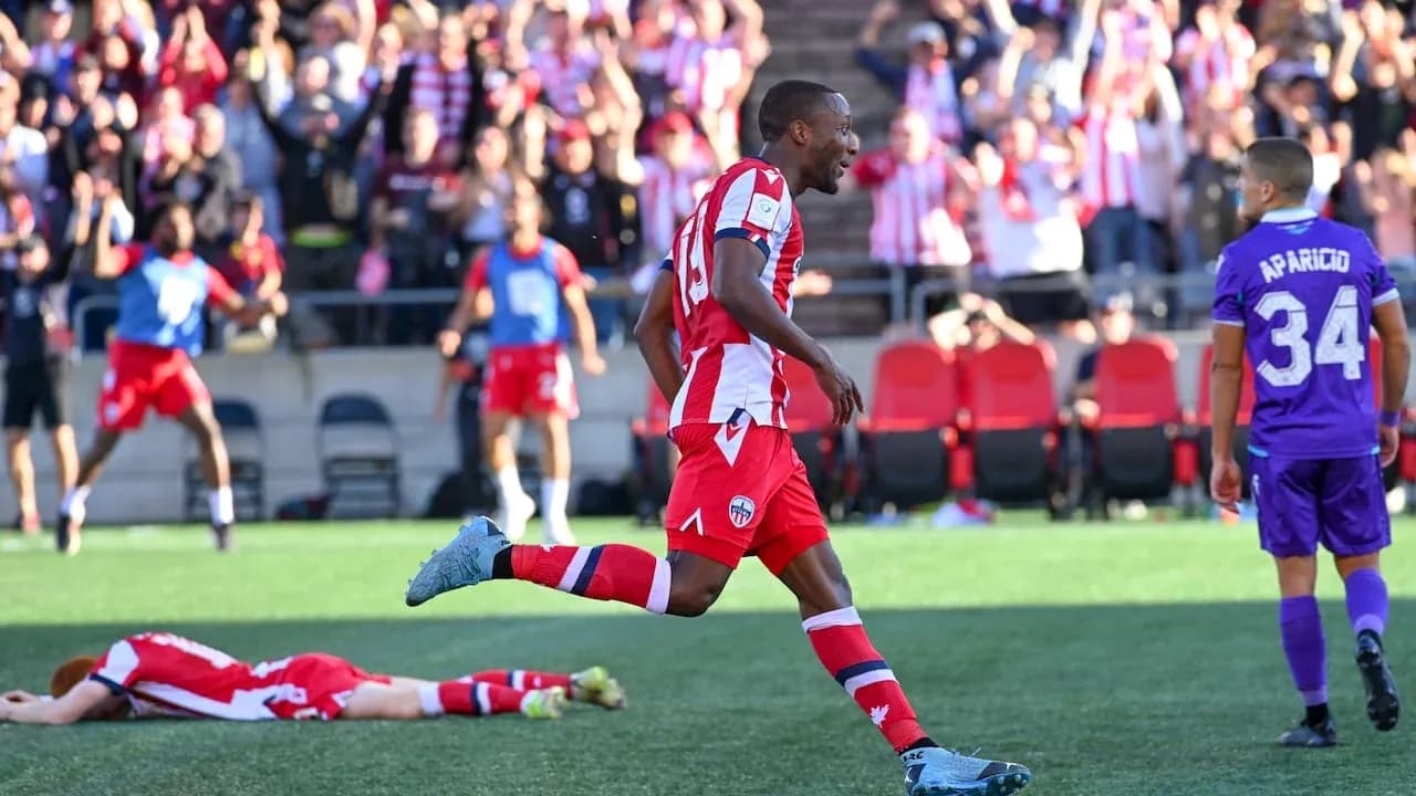 Player celebrating after scoring a goal Player celebrating after scoring a goal