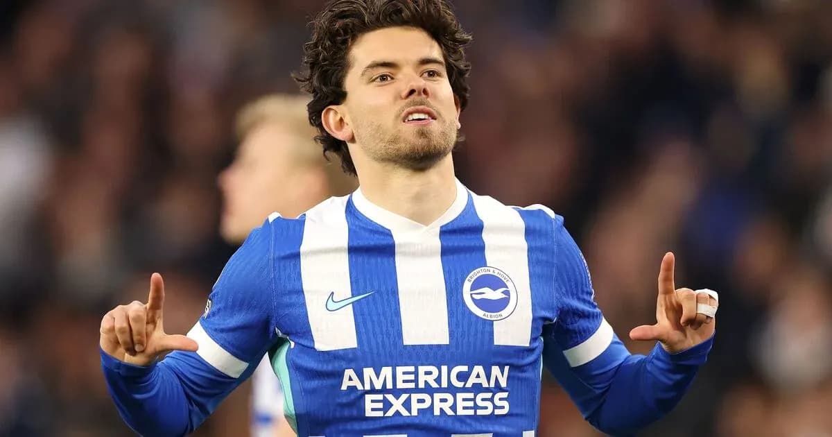Player celebrating a goal in Brighton kit Player celebrating a goal in Brighton kit
