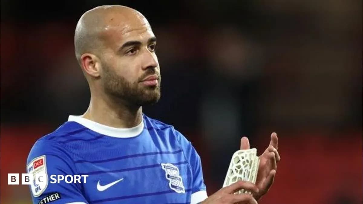 Player in Birmingham City kit applauding fans Player in Birmingham City kit applauding fans