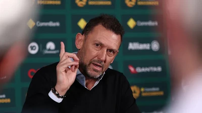 Coach speaking during press conference with gesturing hand Coach speaking during press conference with gesturing hand