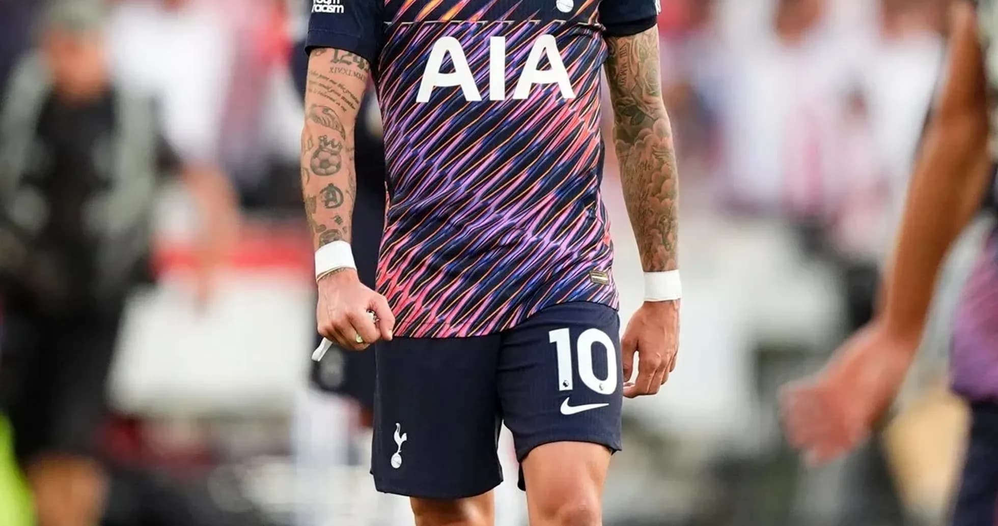 Player in Tottenham kit walking on pitch Player in Tottenham kit walking on pitch