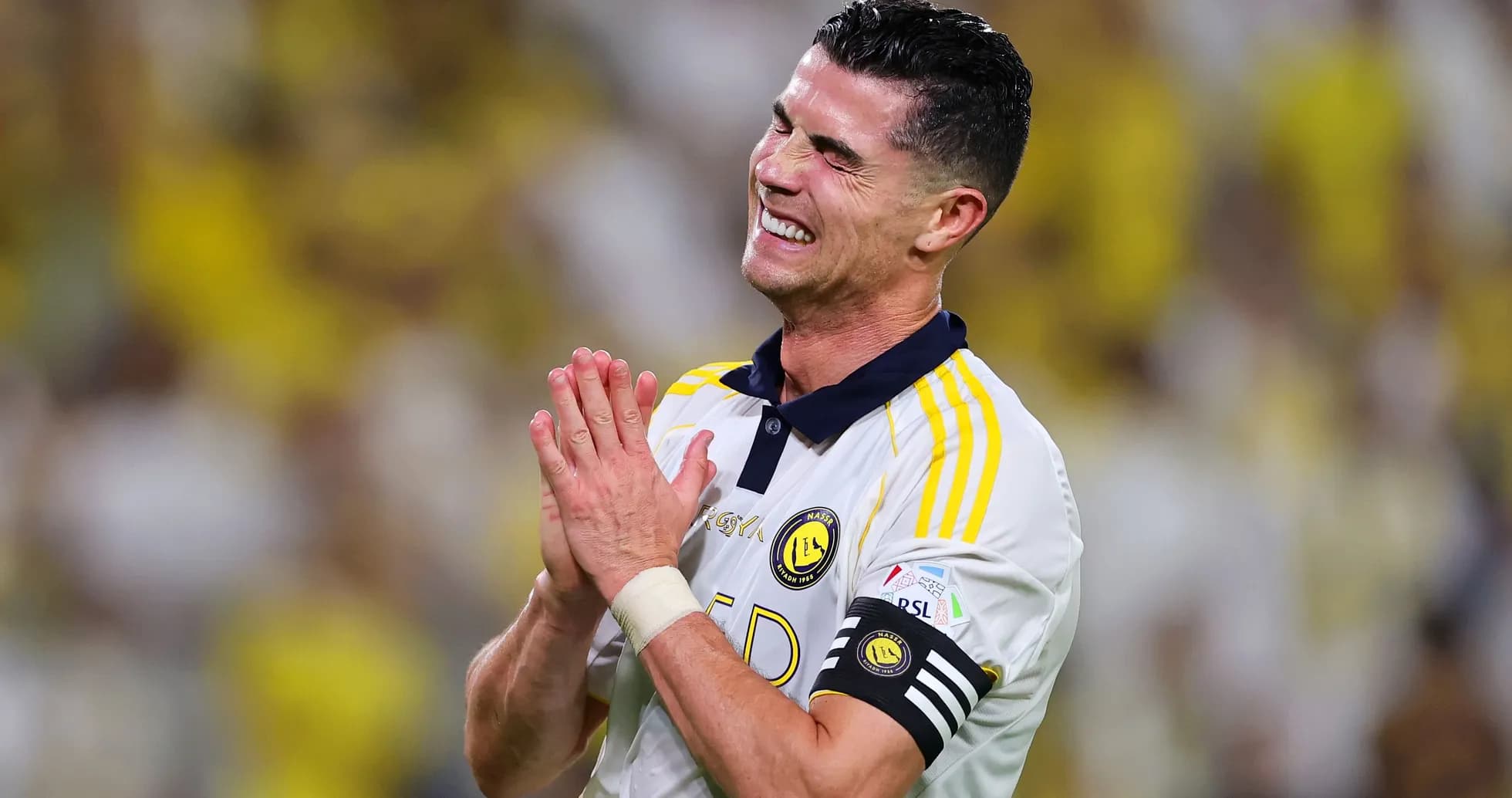 Player celebrating during match with clasped hands Player celebrating during match with clasped hands