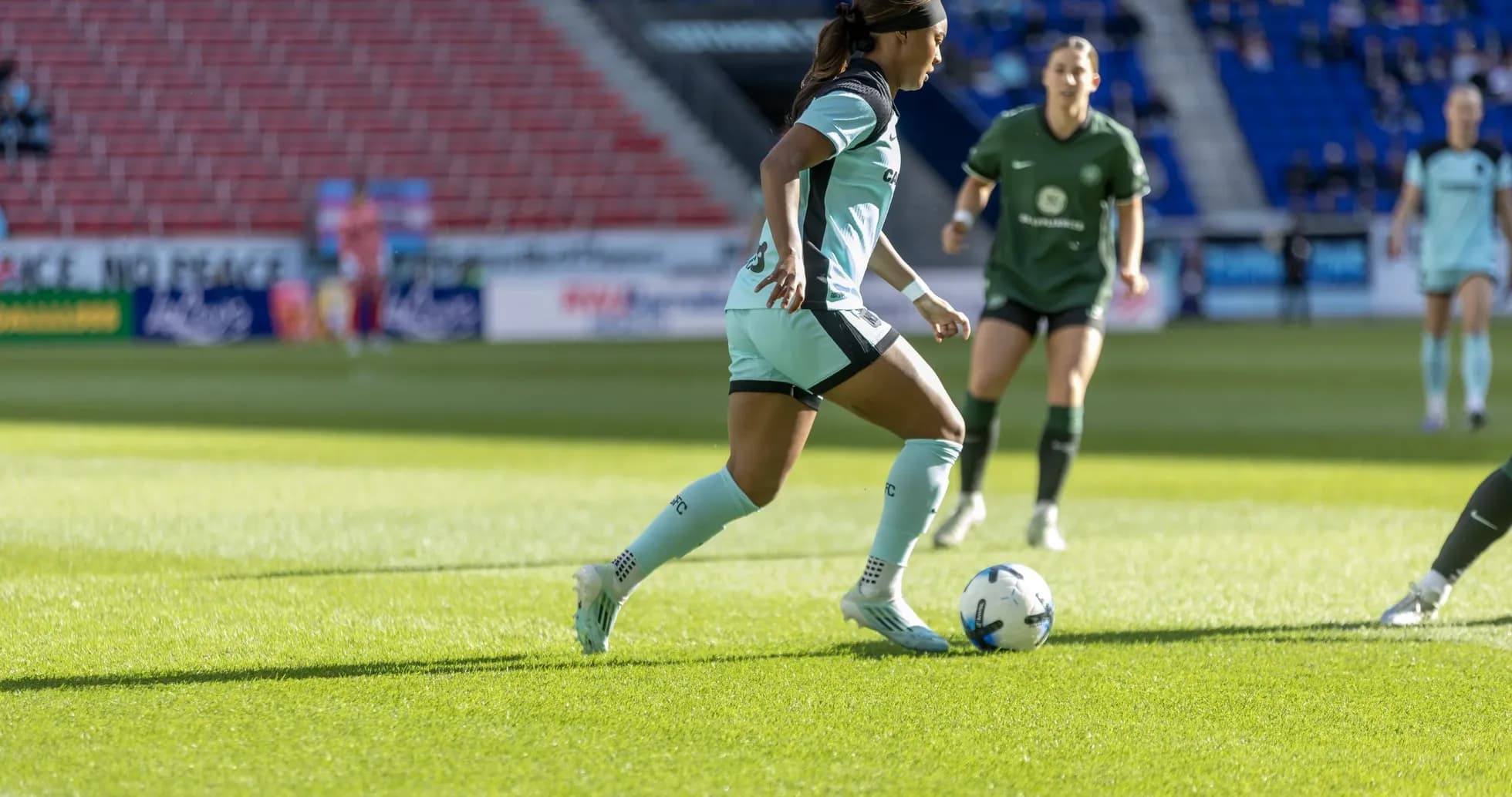 Player dribbling the ball during NWSL match Player dribbling the ball during NWSL match