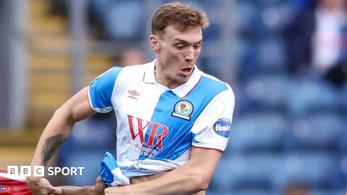 Player in Blackburn Rovers kit during match action Player in Blackburn Rovers kit during match action