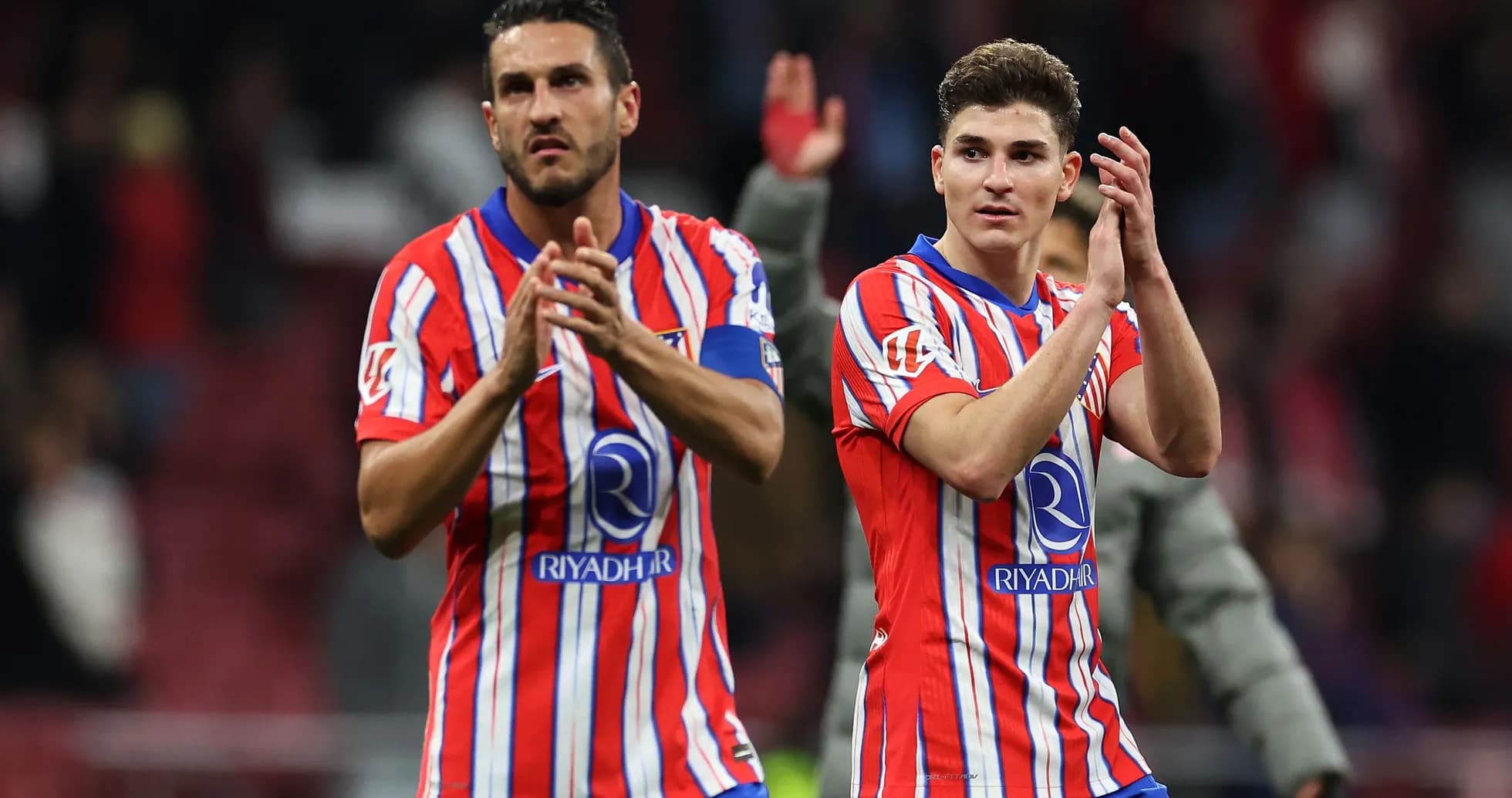 Two players applauding fans after the match Two players applauding fans after the match