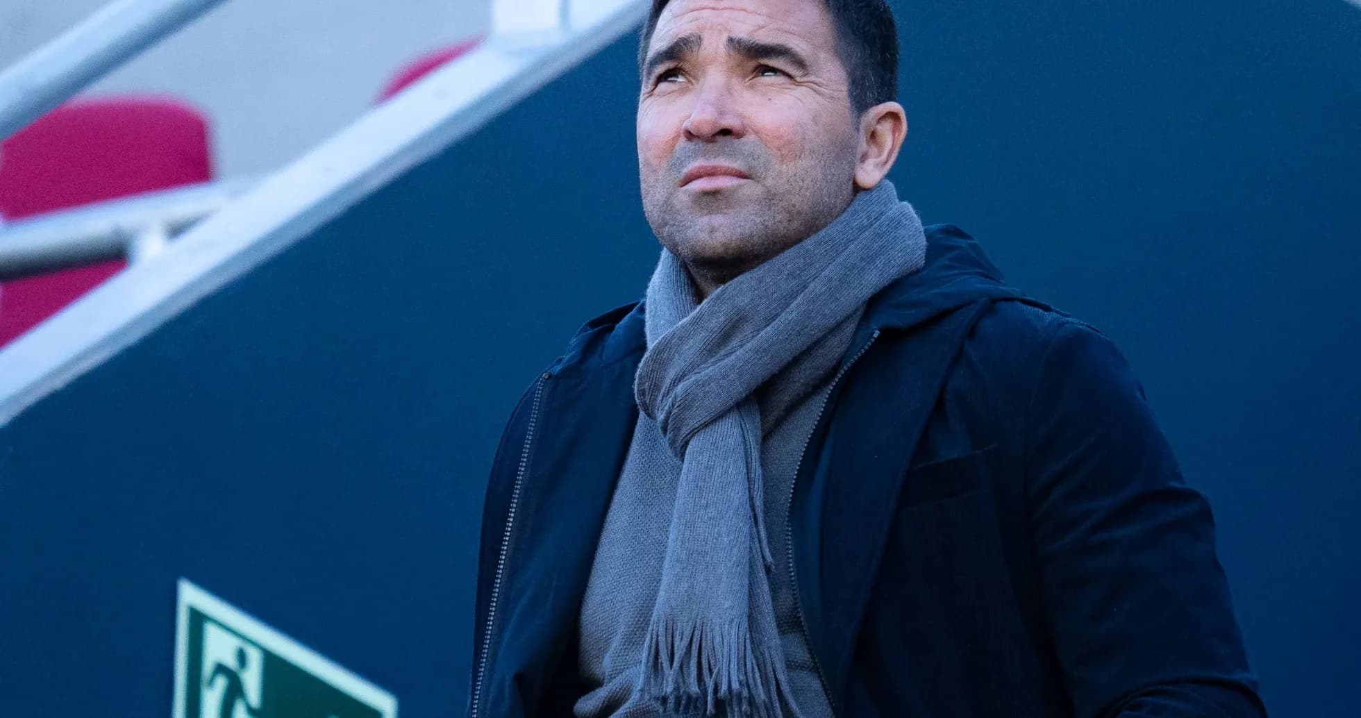 Man looking up while wearing a scarf outdoors Man looking up while wearing a scarf outdoors