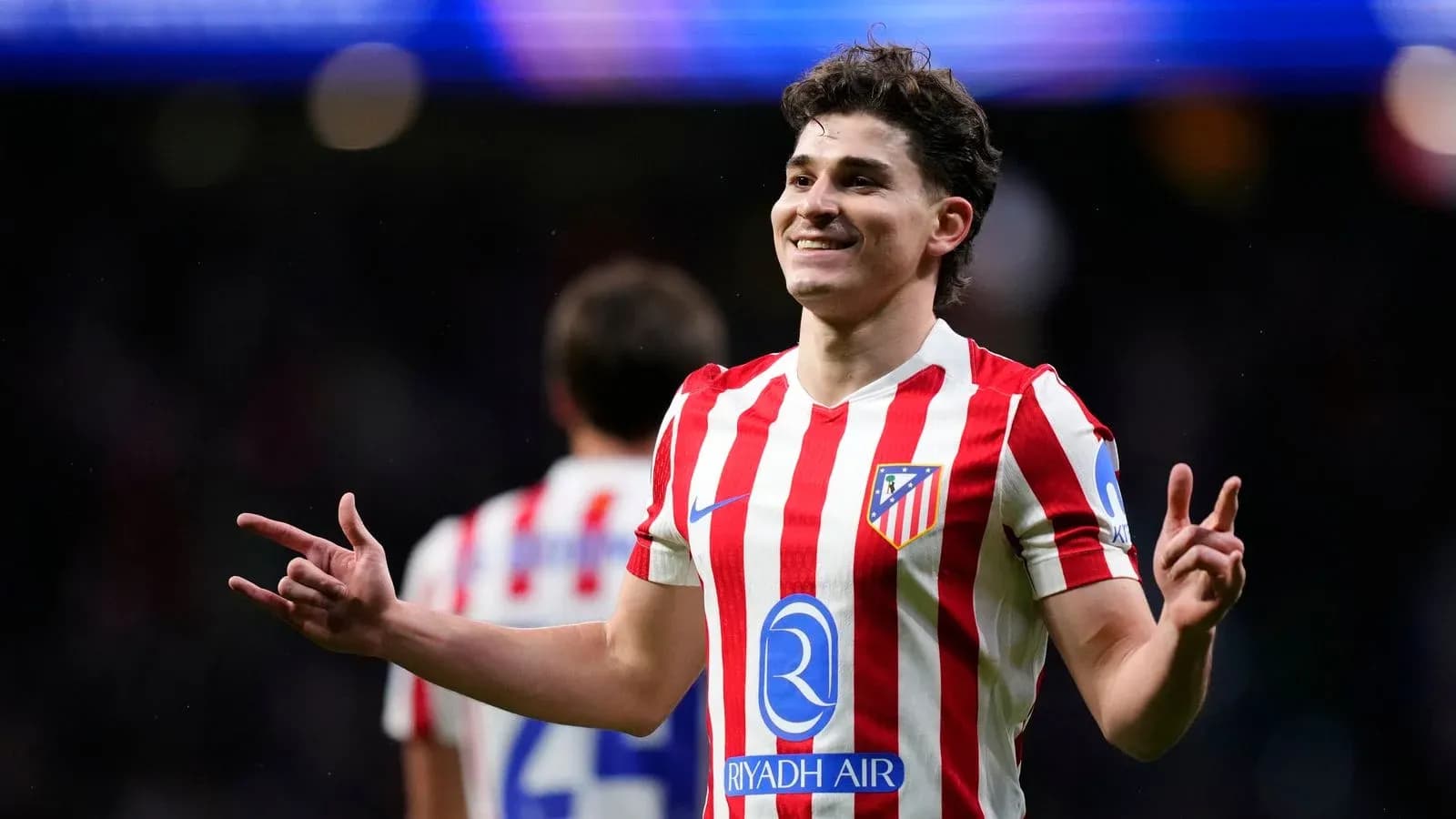 Atletico Madrid player celebrating during a match Atletico Madrid player celebrating during a match
