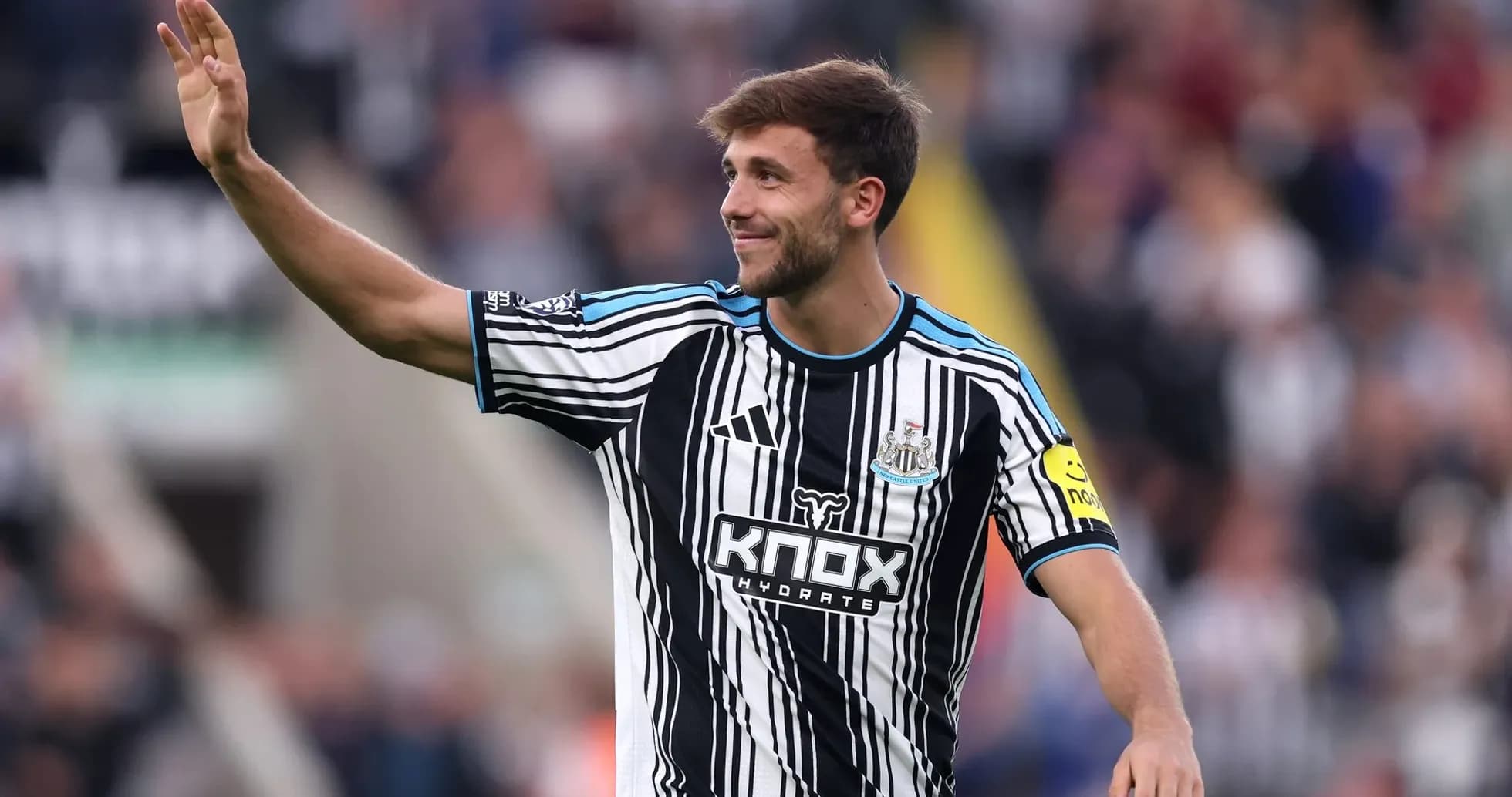 Newcastle player waving to fans during match Newcastle player waving to fans during match