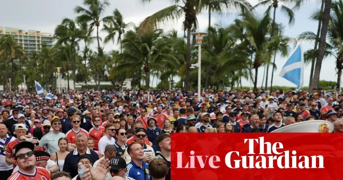 Large crowd of fans at outdoor event with flags Large crowd of fans at outdoor event with flags