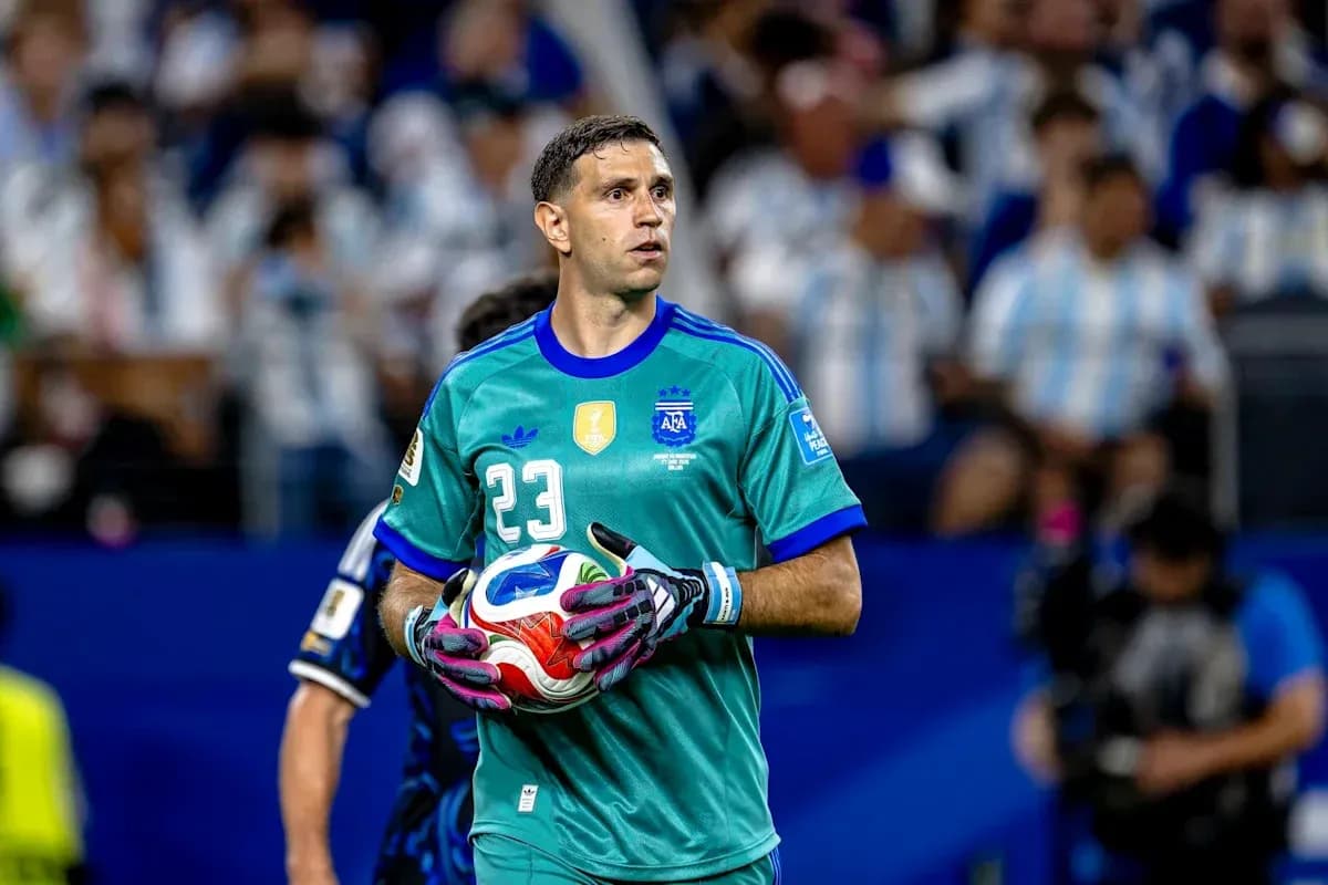 Goalkeeper in green uniform holding soccer ball Goalkeeper in green uniform holding soccer ball