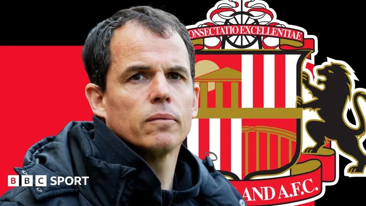 Coach in front of Sunderland A.F.C. logo Coach in front of Sunderland A.F.C. logo