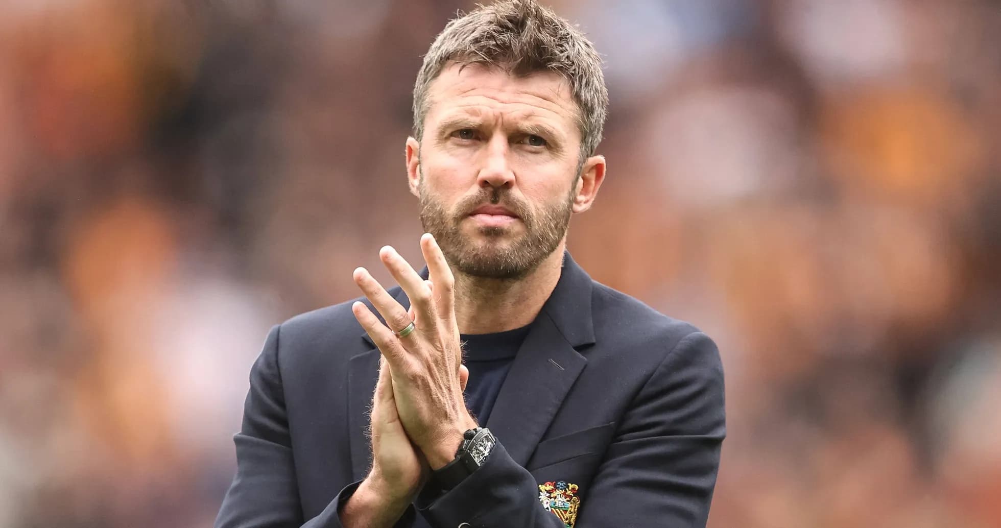 Manager applauding during match at stadium Manager applauding during match at stadium