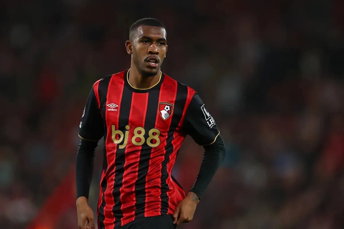 Bournemouth player wearing red and black kit on field Bournemouth player wearing red and black kit on field