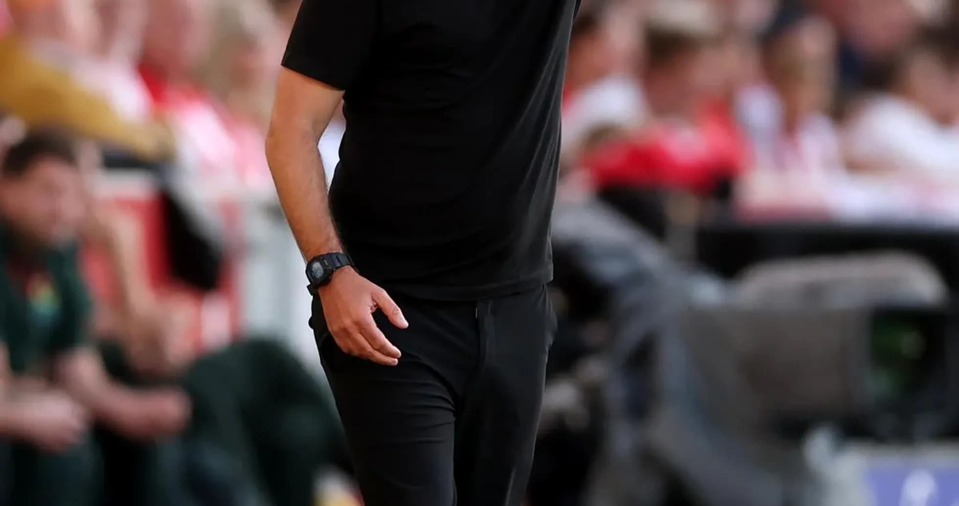Manager giving instructions from the sidelines during match Manager giving instructions from the sidelines during match