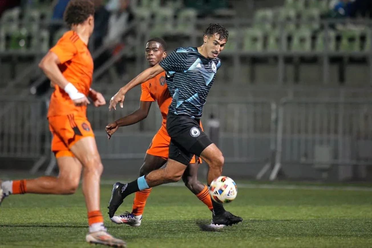 Tacoma Defiance player dribbling past Houston Dynamo FC II Tacoma Defiance player dribbling past Houston Dynamo FC II
