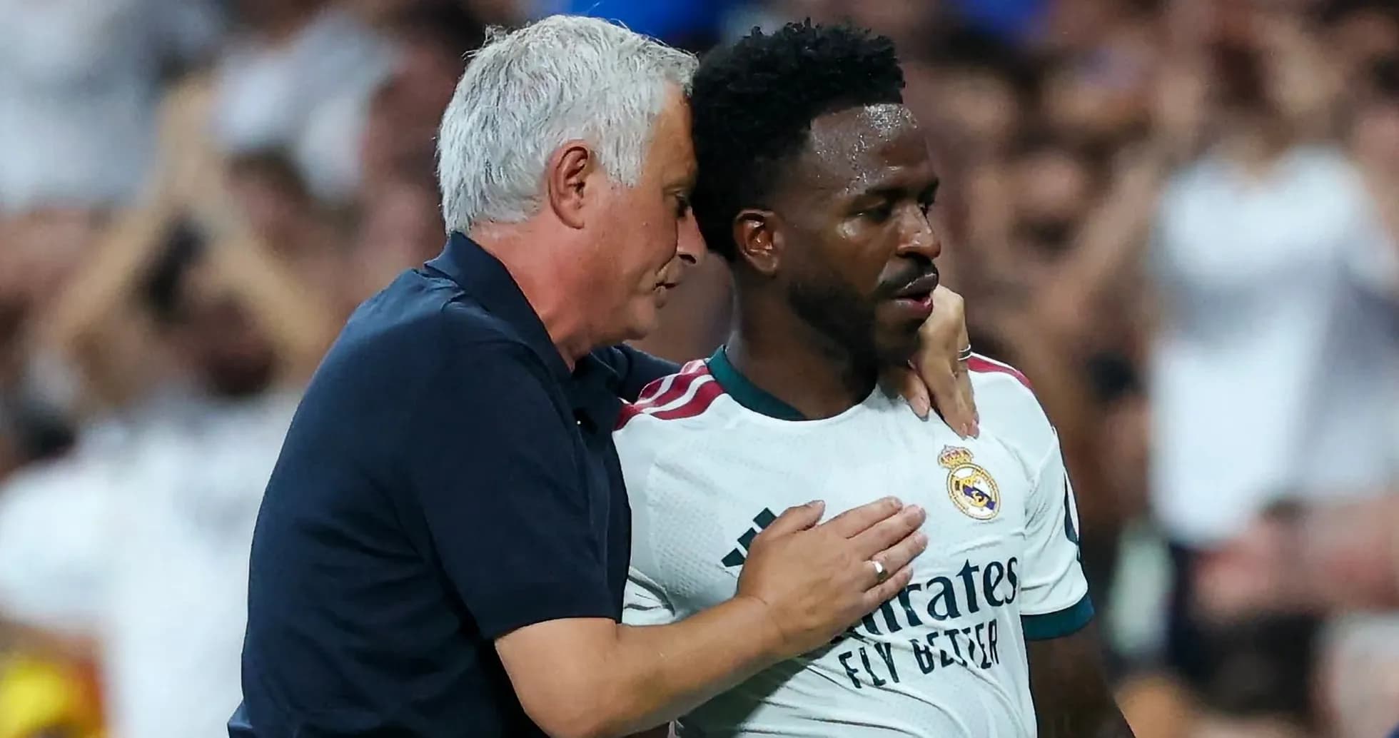 Manager speaking to player during match on field Manager speaking to player during match on field