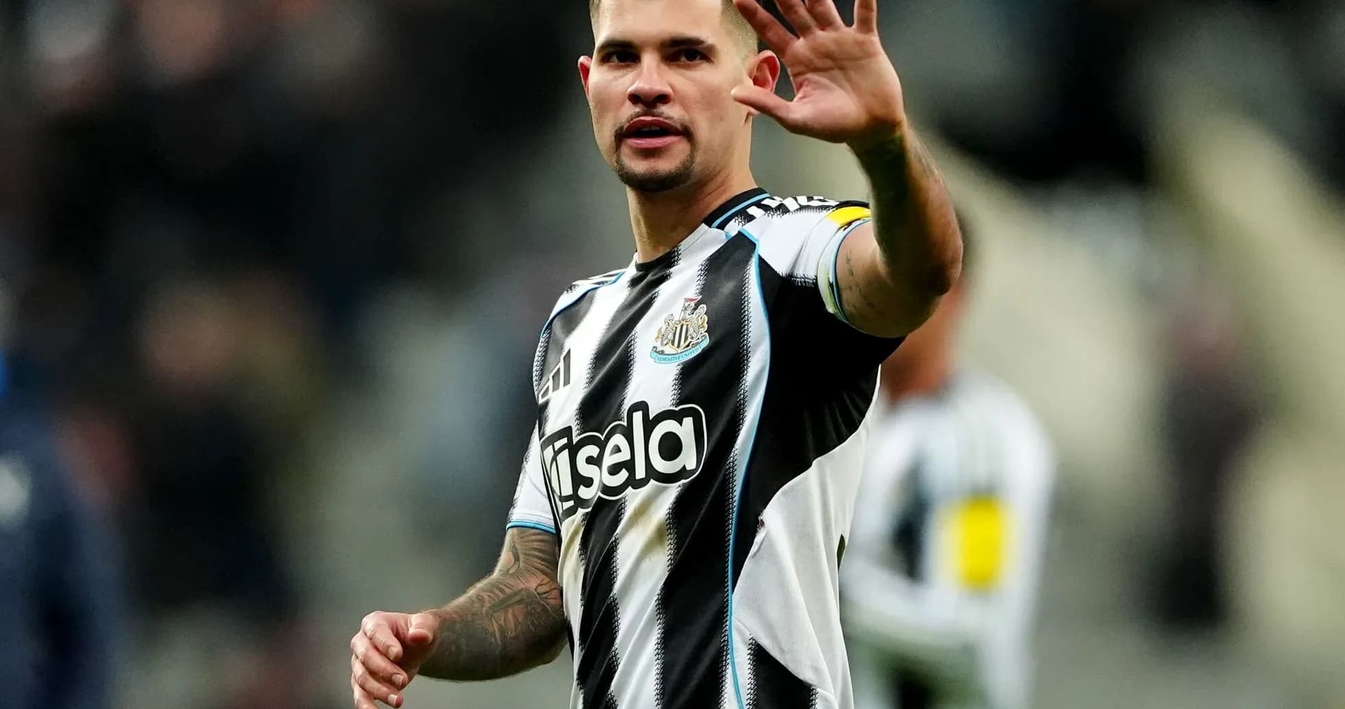 Player waving to fans during match at St James' Park Player waving to fans during match at St James' Park