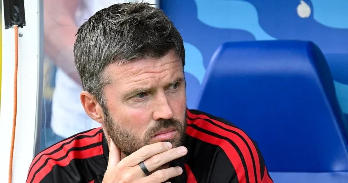Coach in black shirt with red stripes thinking Coach in black shirt with red stripes thinking