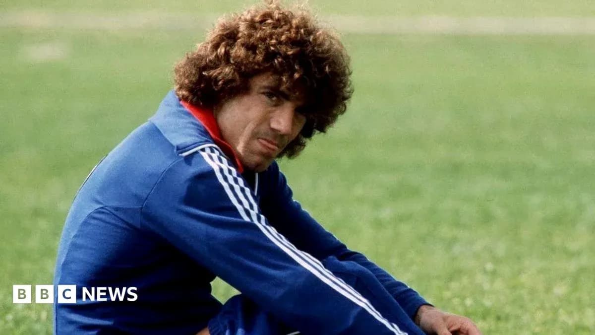 Player sitting on grass field in training gear Player sitting on grass field in training gear