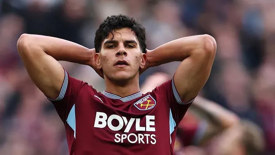Player in West Ham kit with hands on head Player in West Ham kit with hands on head