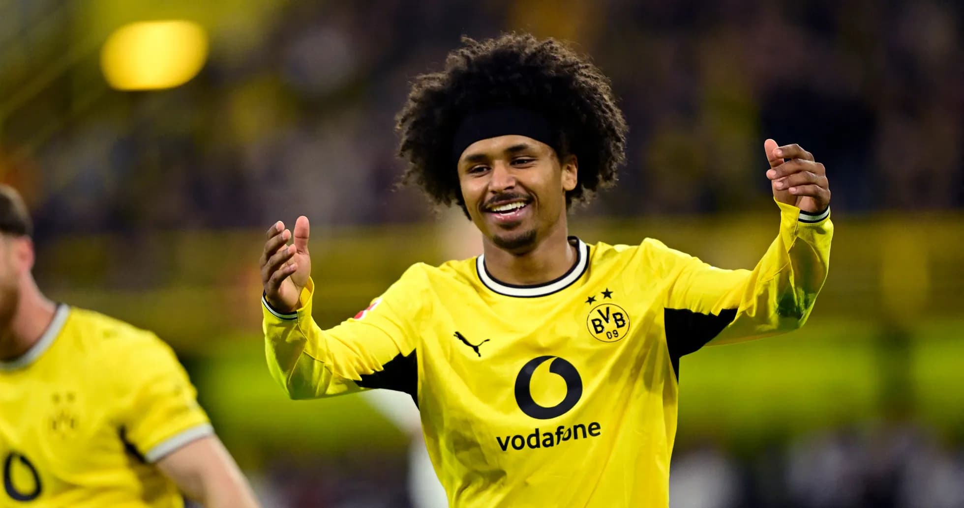 Borussia Dortmund player celebrating on the pitch Borussia Dortmund player celebrating on the pitch