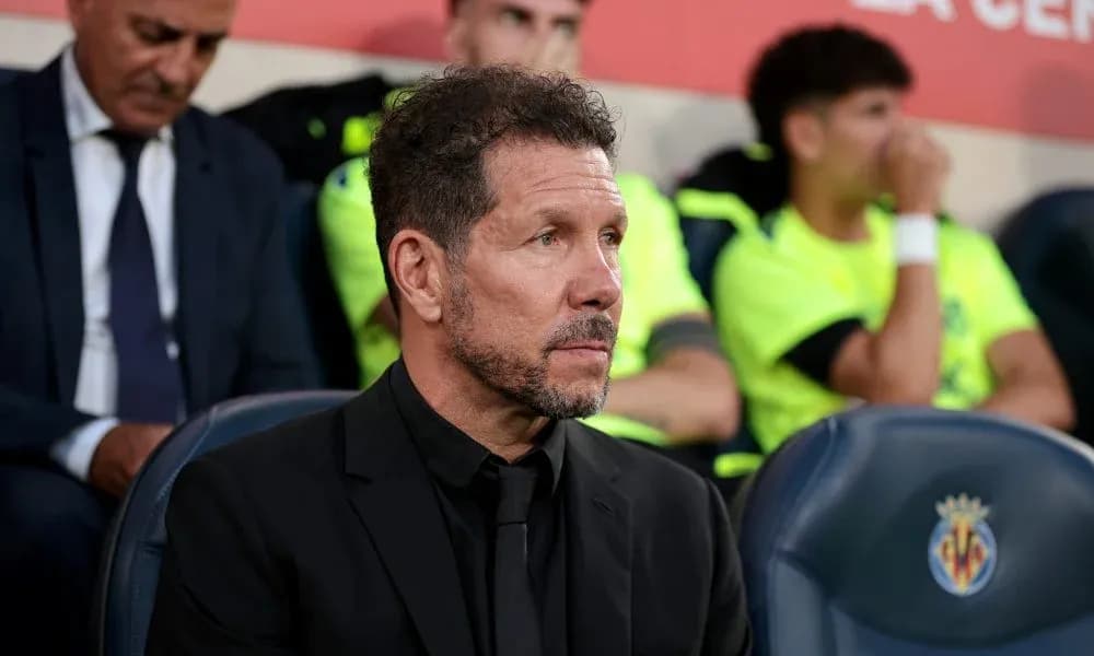 Coach sitting on the bench during a match Coach sitting on the bench during a match