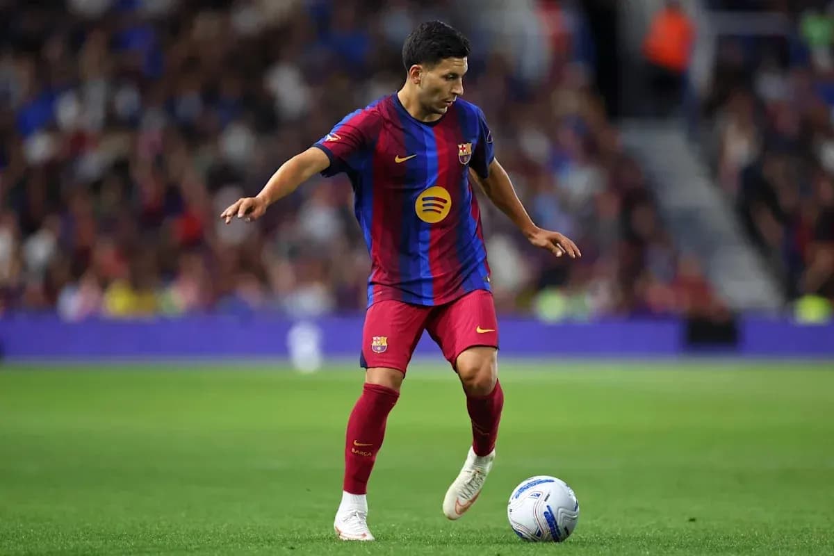 Player dribbling ball during match at stadium Player dribbling ball during match at stadium