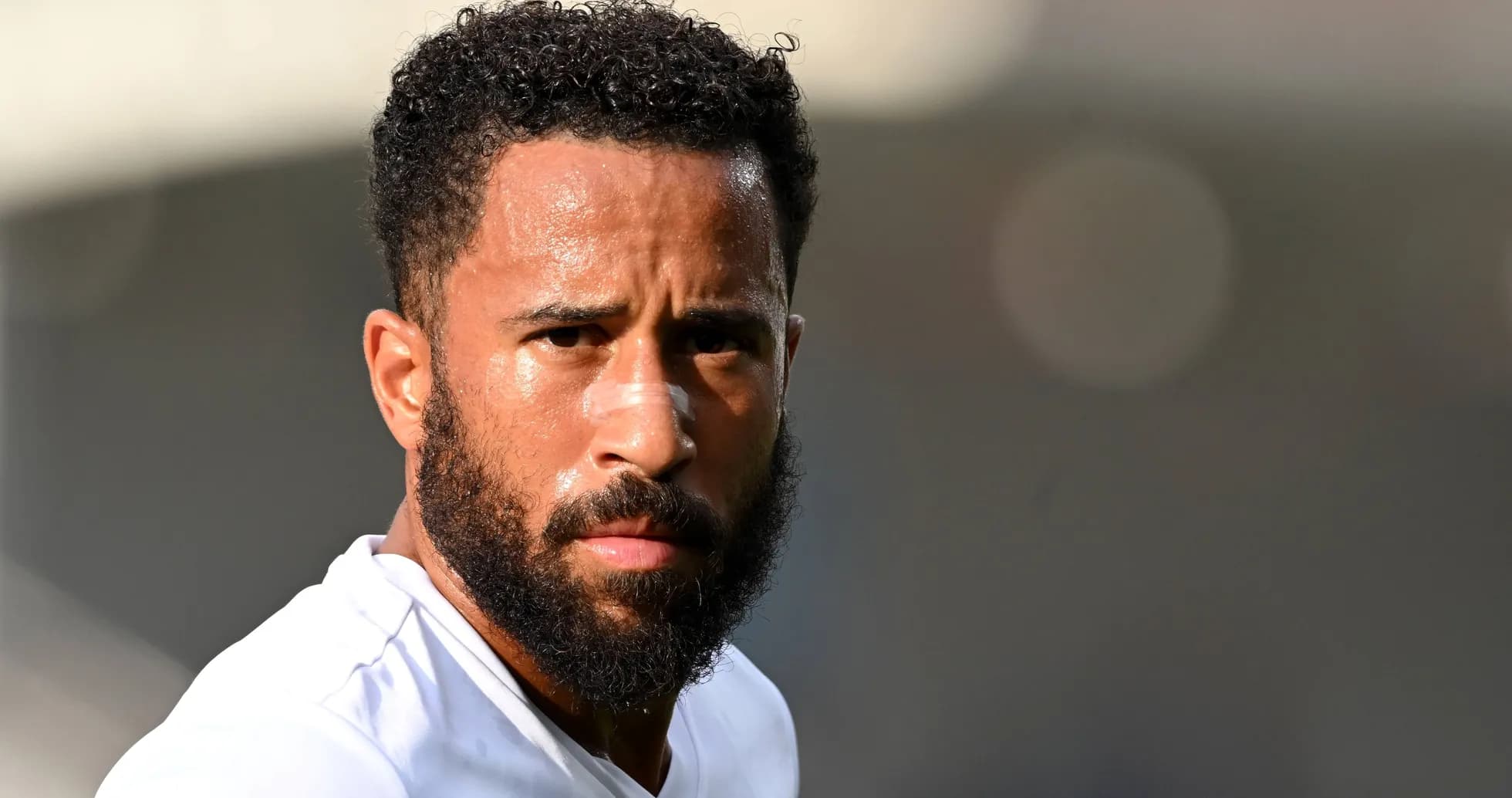 Player with beard and bandage during warm-up Player with beard and bandage during warm-up