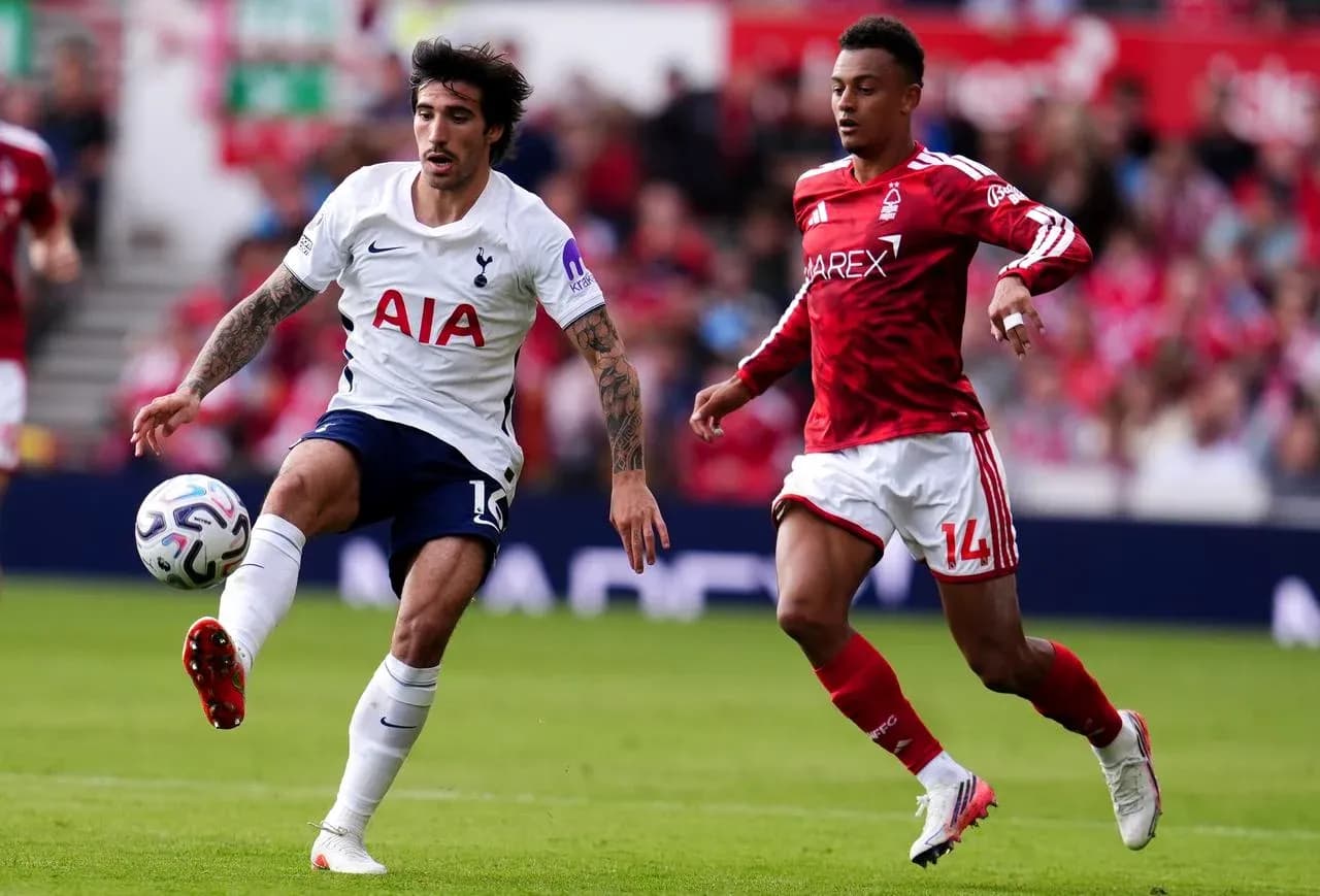 Nottingham Forest player challenges Tottenham midfielder Nottingham Forest player challenges Tottenham midfielder