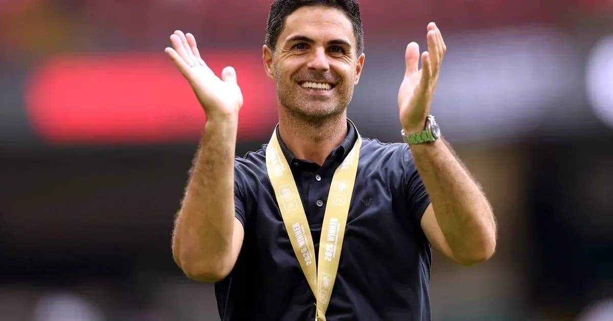 Coach celebrating with hands raised during event Coach celebrating with hands raised during event