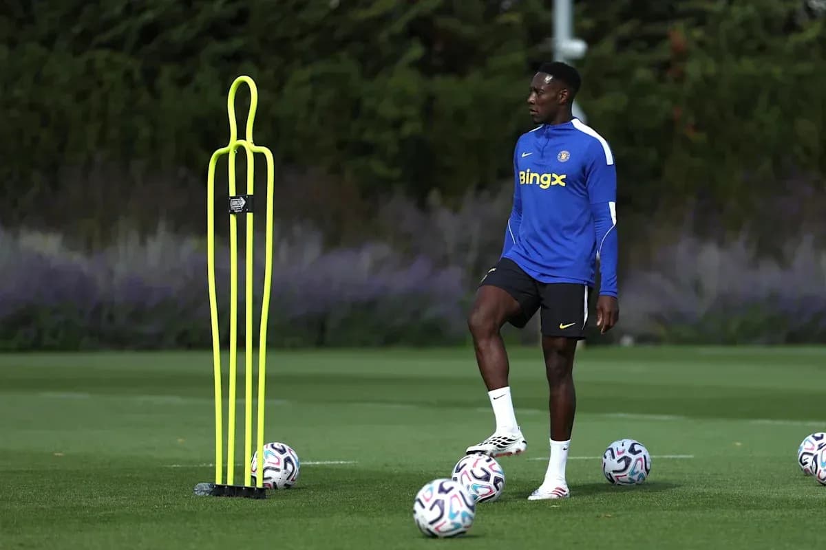 Player practicing near training dummy and soccer balls Player practicing near training dummy and soccer balls