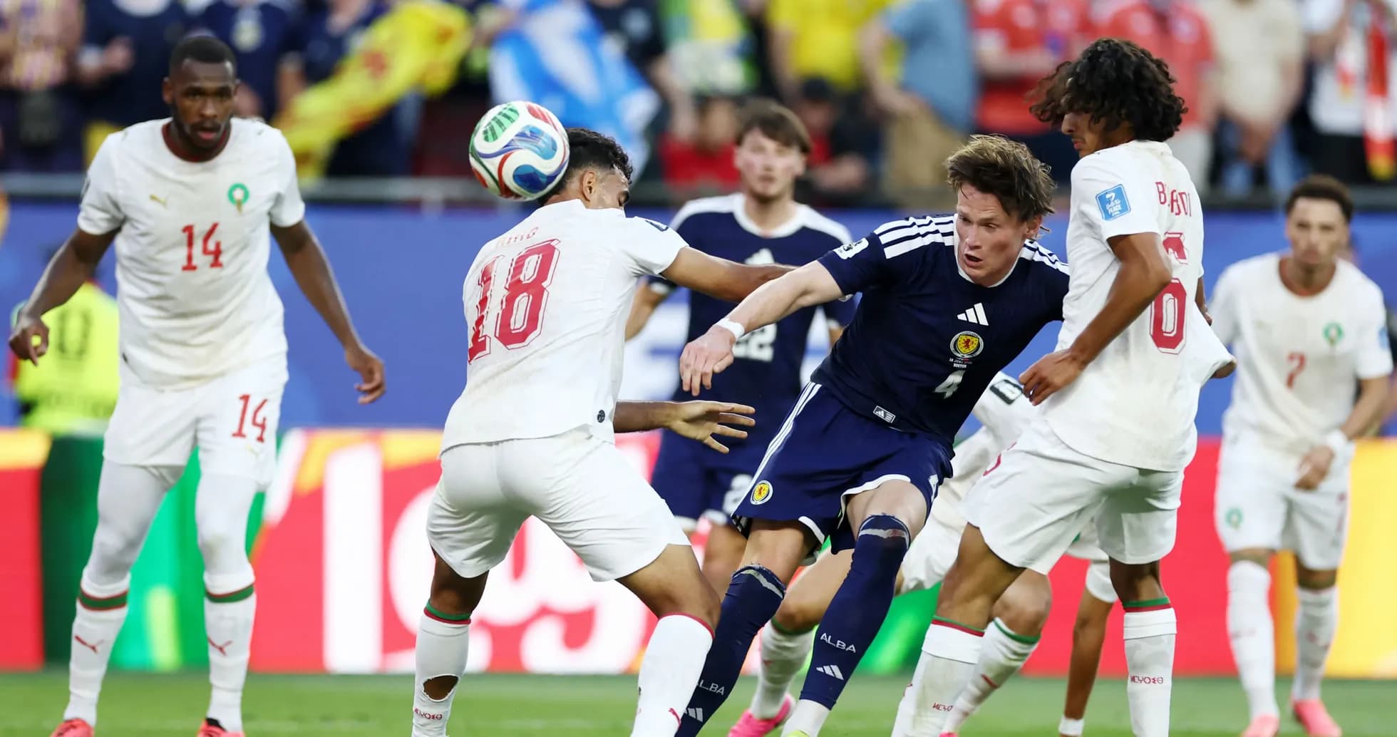 Players contesting the ball during a match Players contesting the ball during a match