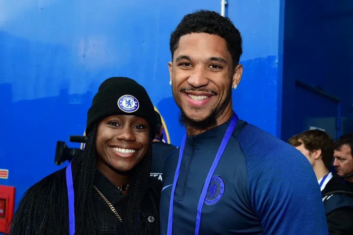 Two Chelsea FC fans posing for a photo Two Chelsea FC fans posing for a photo