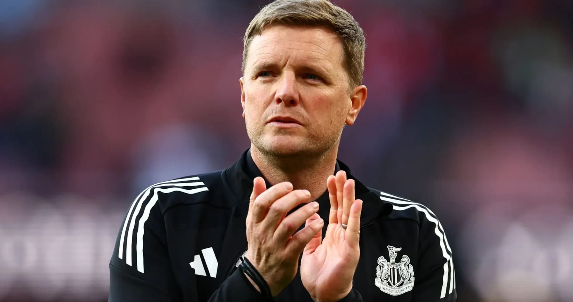 Newcastle United manager applauding fans on pitch Newcastle United manager applauding fans on pitch