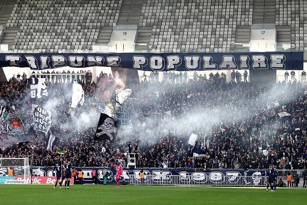 Crowd of fans with banners and smoke at stadium Crowd of fans with banners and smoke at stadium