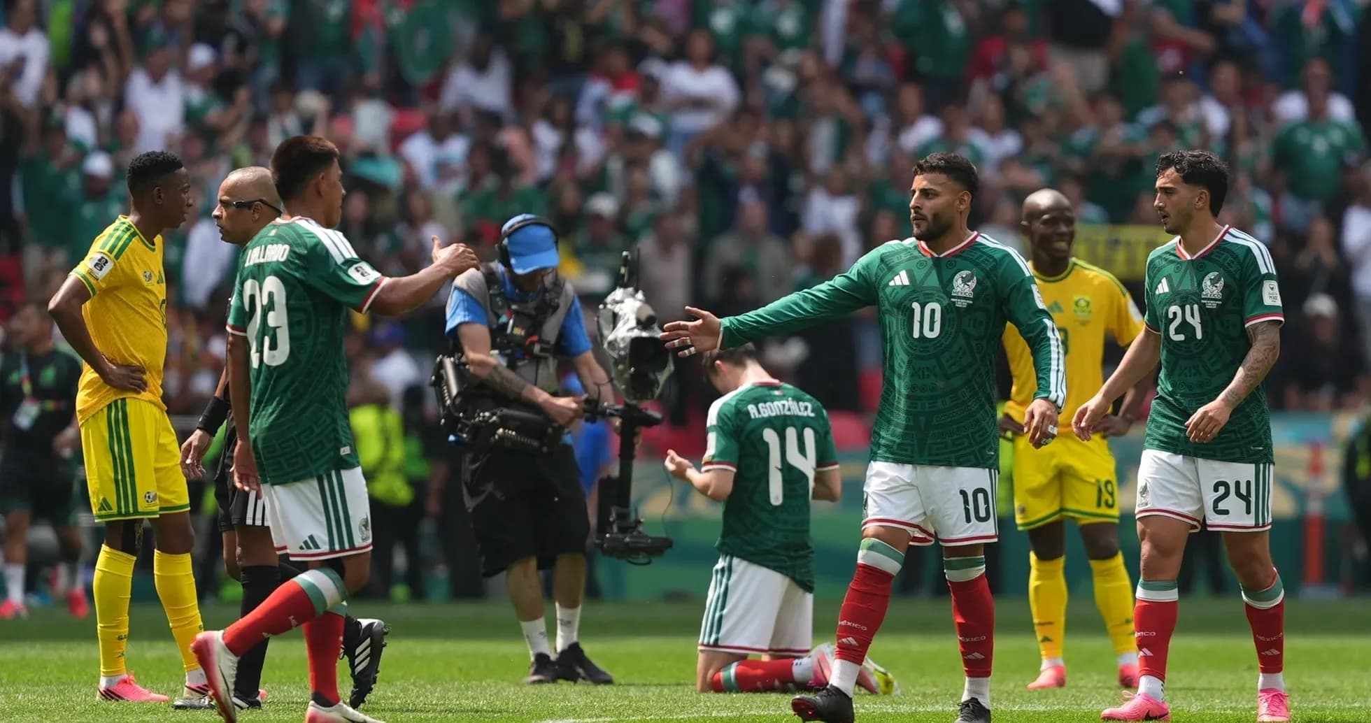 Players interacting during Mexico vs South Africa match Players interacting during Mexico vs South Africa match