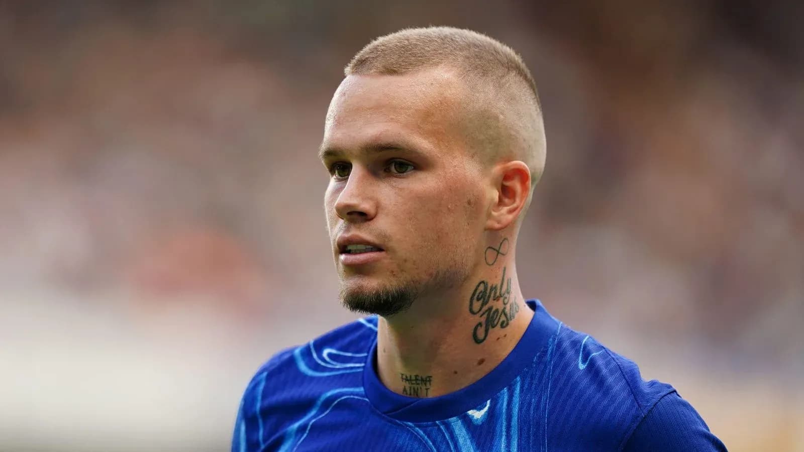 Player with tattoos during training session Player with tattoos during training session