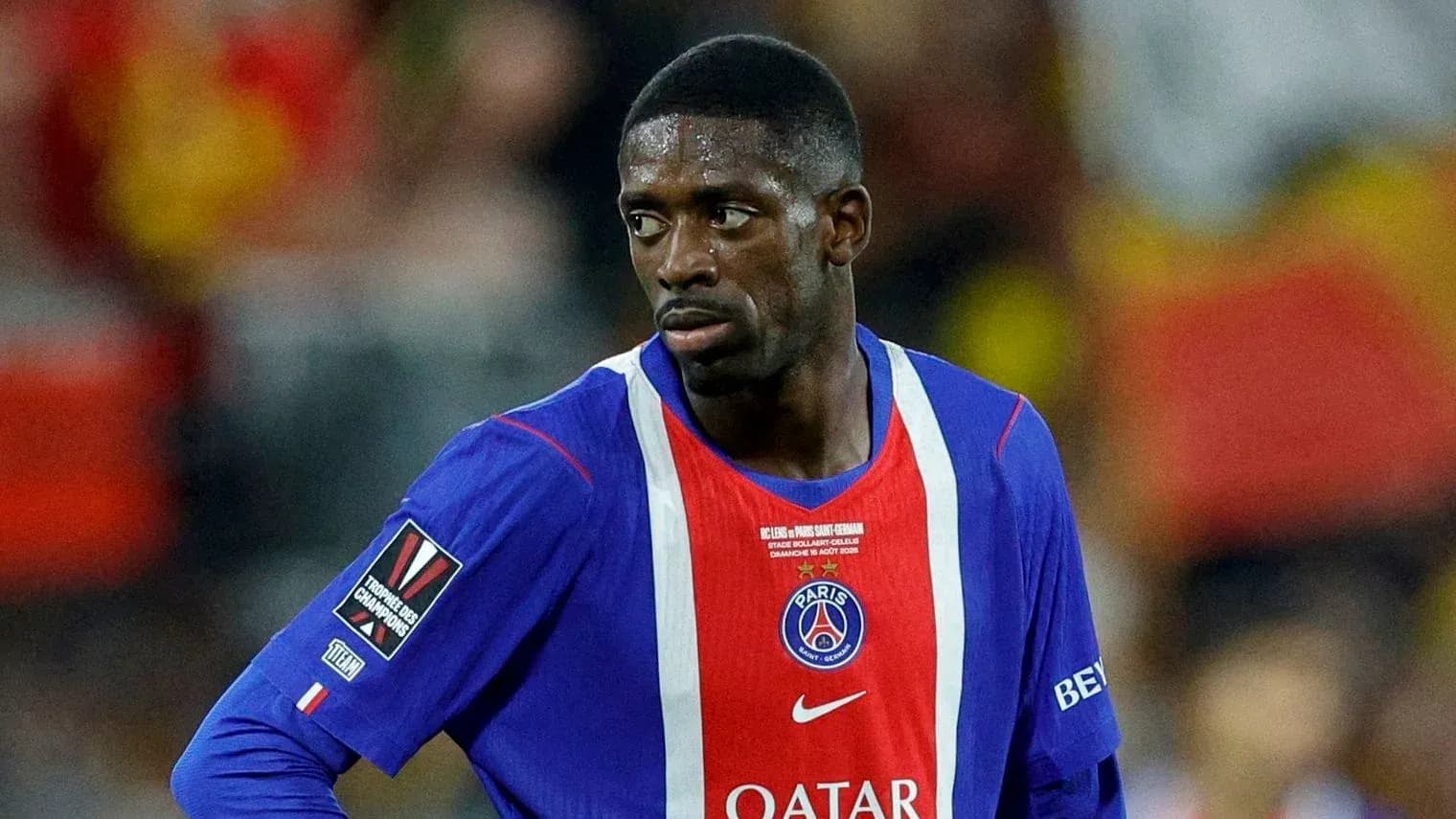Player in PSG jersey during match action Player in PSG jersey during match action