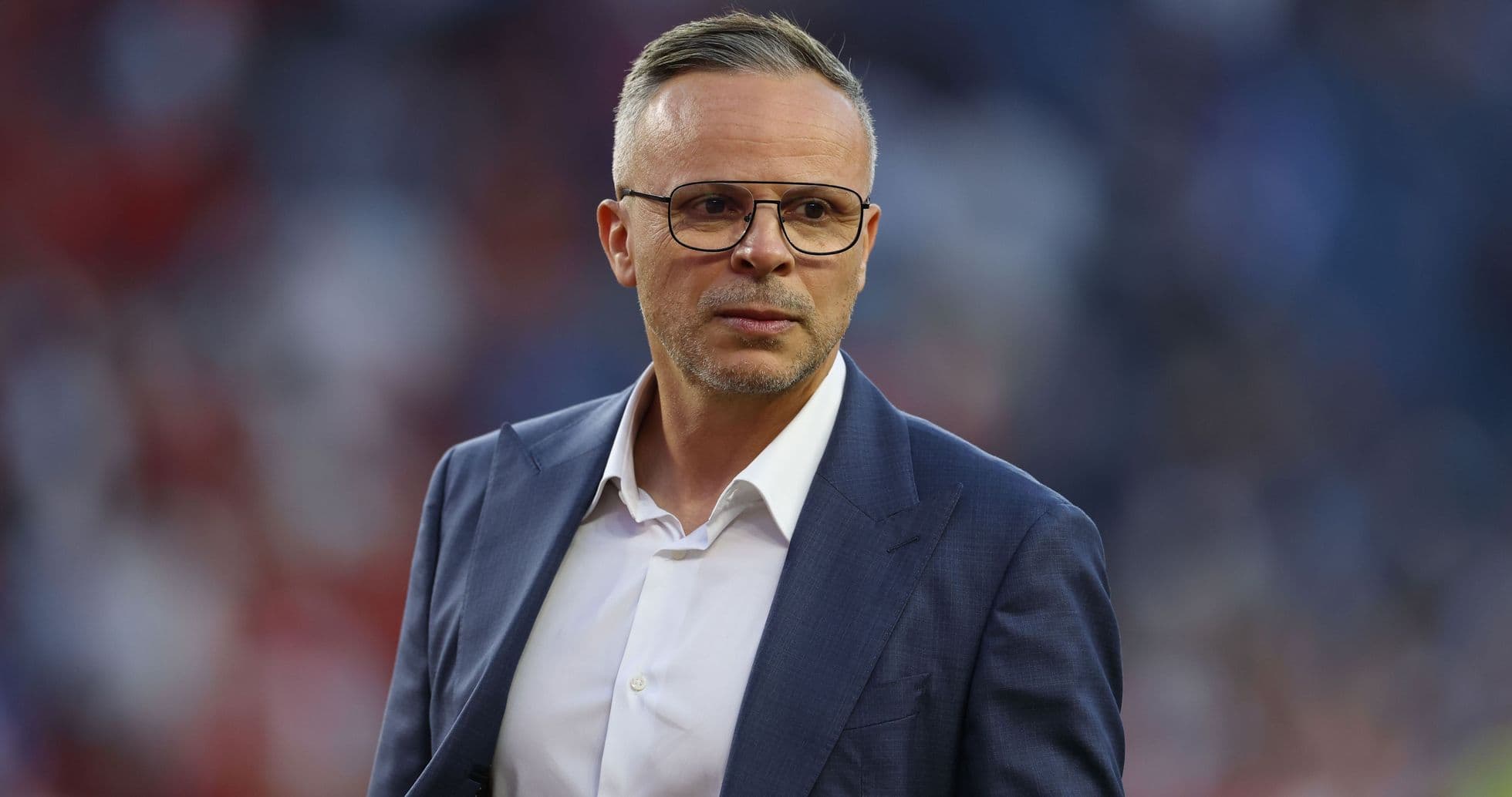 Coach in suit during match on field Coach in suit during match on field