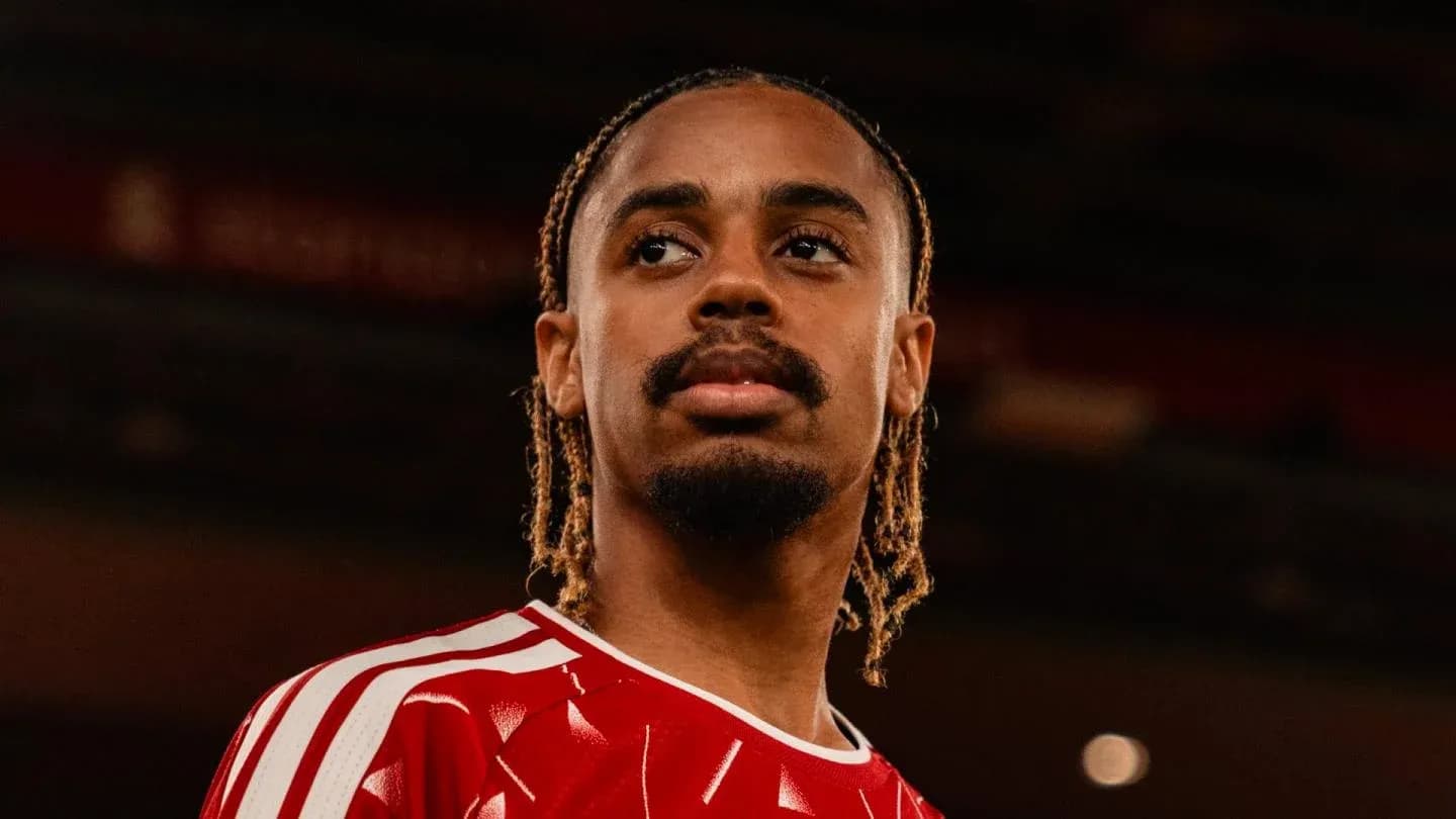 Player in red jersey looking off-camera Player in red jersey looking off-camera
