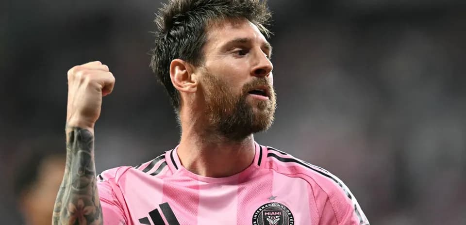 Player celebrating in pink jersey after scoring Player celebrating in pink jersey after scoring