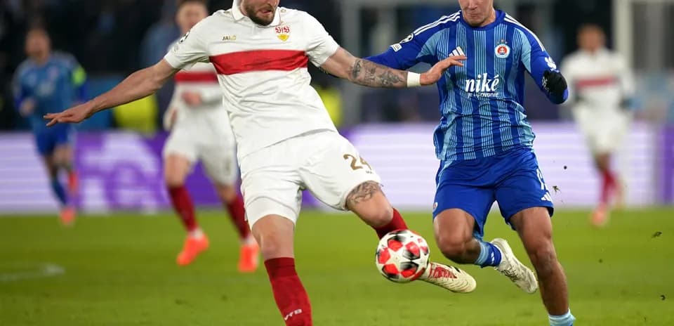 Slovan Bratislava player challenging VfB Stuttgart player Slovan Bratislava player challenging VfB Stuttgart player